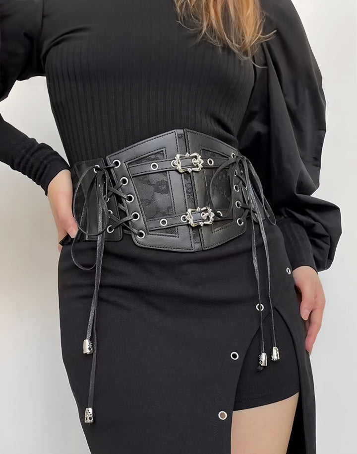model in black outfit styling the vintage style gothic waist belt featuring buckle and ties