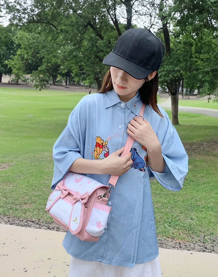 model wearing the bunny ears kawaii shoulder bag and standing in the outdoor park