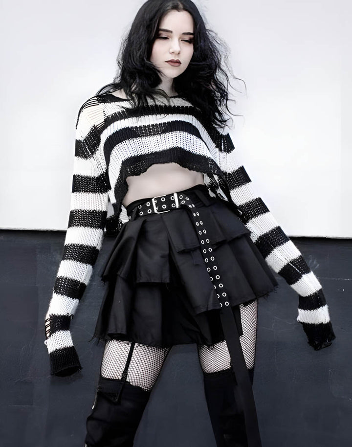 goth girl wearing distressed sweater