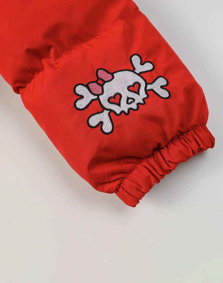 Close-up of the adorable Hello Kitty patch detail on the cuff of the Puffer Jacket, adding a touch of charm.