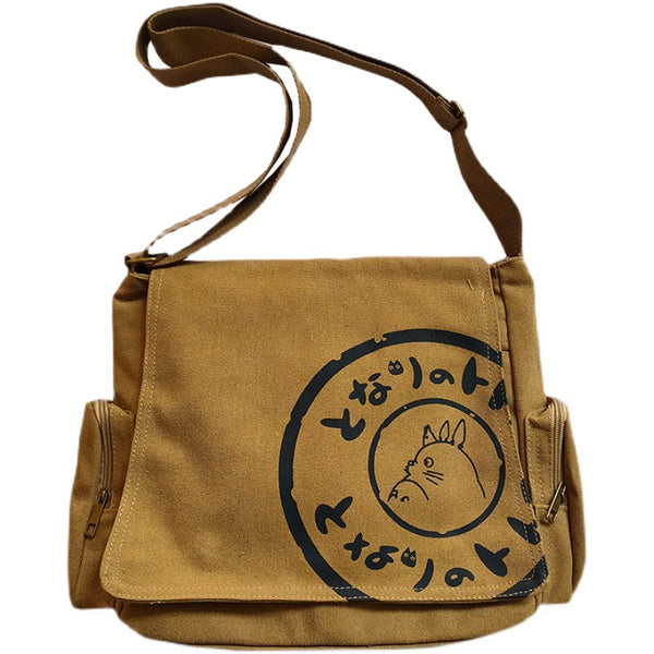 Brown Totoro messenger bag featuring black Totoro graphic and Japanese characters.