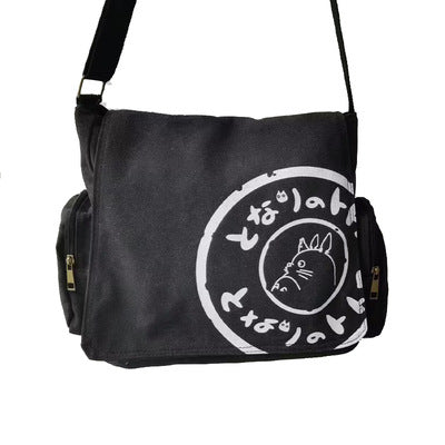 Black Totoro messenger bag with white Totoro graphic and Japanese characters.