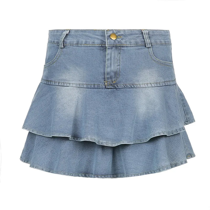 Front view of a Y2K denim ruffle skirt with high-waist design and light blue wash, displayed on a white background, featuring dual-layered ruffles.