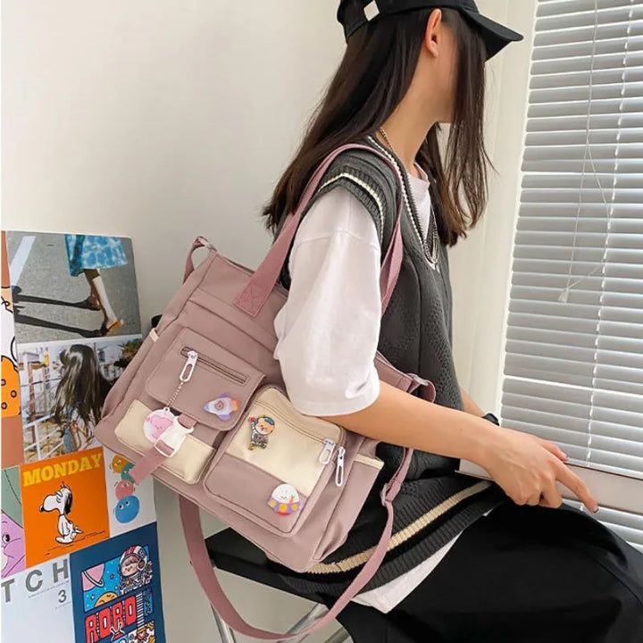 Model wearing the pink Kawaii Multi-Pocket Nylon Shoulder Bag, highlighting its stylish look and functional pockets for everyday use.