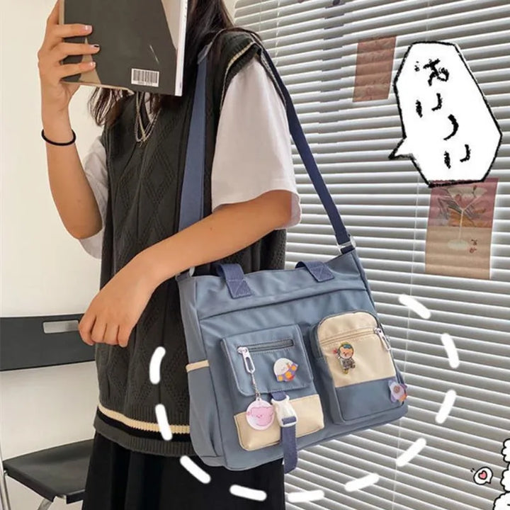 Model wearing the blue Kawaii Multi-Pocket Nylon Shoulder Bag, displaying its practical and cute design, perfect for school or casual outings.