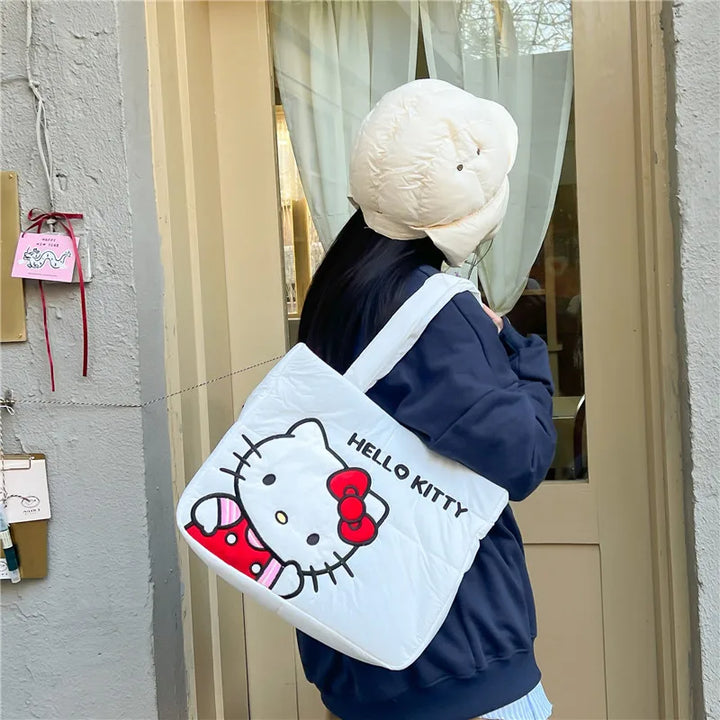 Hello Kitty puffer bag with a comfortable padded strap, ideal for school or university. Shop now at Street Kawaii for kawaii fashion.