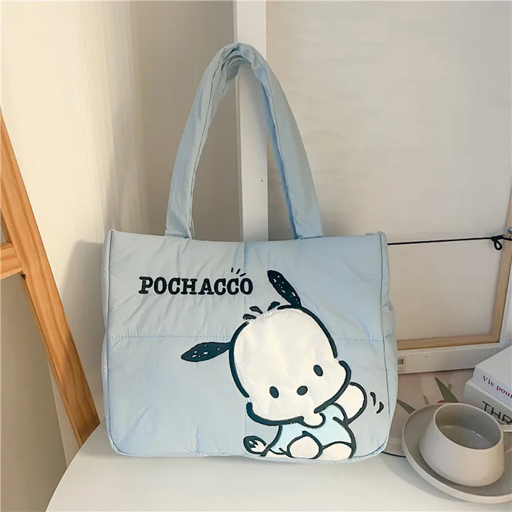 Pochacco puffer bag displayed on a table, perfect for carrying school essentials. Available at Street Kawaii for back to school 2024.