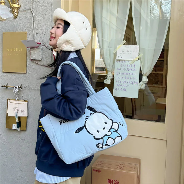 Pochacco puffer bag with soft padded strap, perfect for carrying essentials. Get this cute Sanrio bag at Street Kawaii.