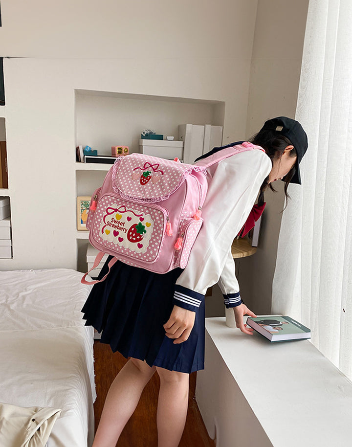 Model is wearing a cute pink bag