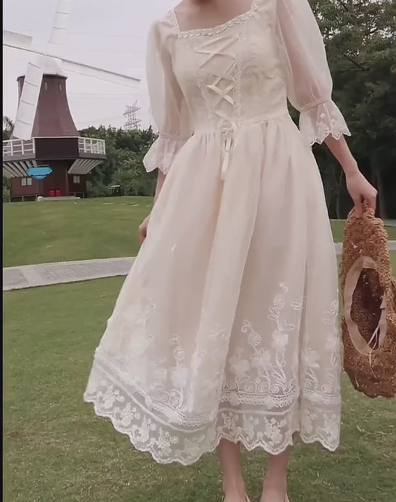 video of a model wearing cottage core midi dress