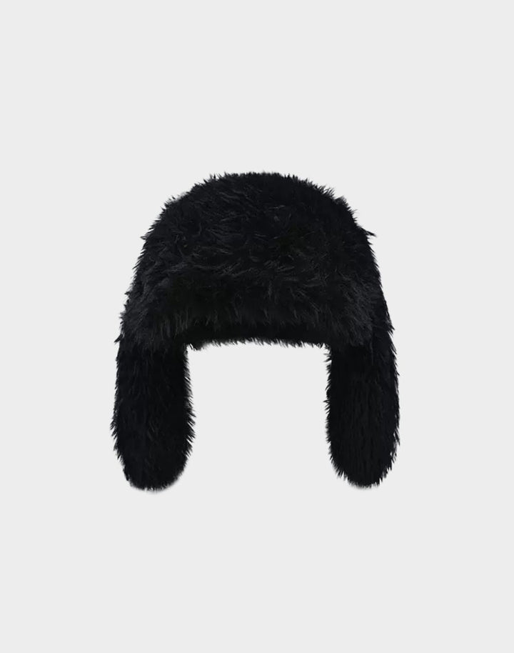 Chic black winter beanie with bunny ears, contrasted against a white background for a bold Y2K look.