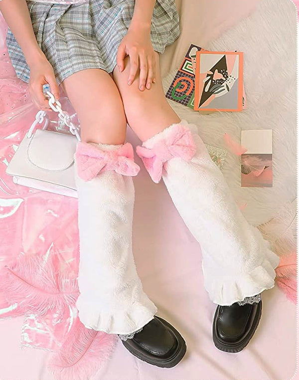 Model showcasing the Pink Bow White Leg Warmers, paired with a trendy Kawaii outfit, highlighting the flared design and adorable pink bow.